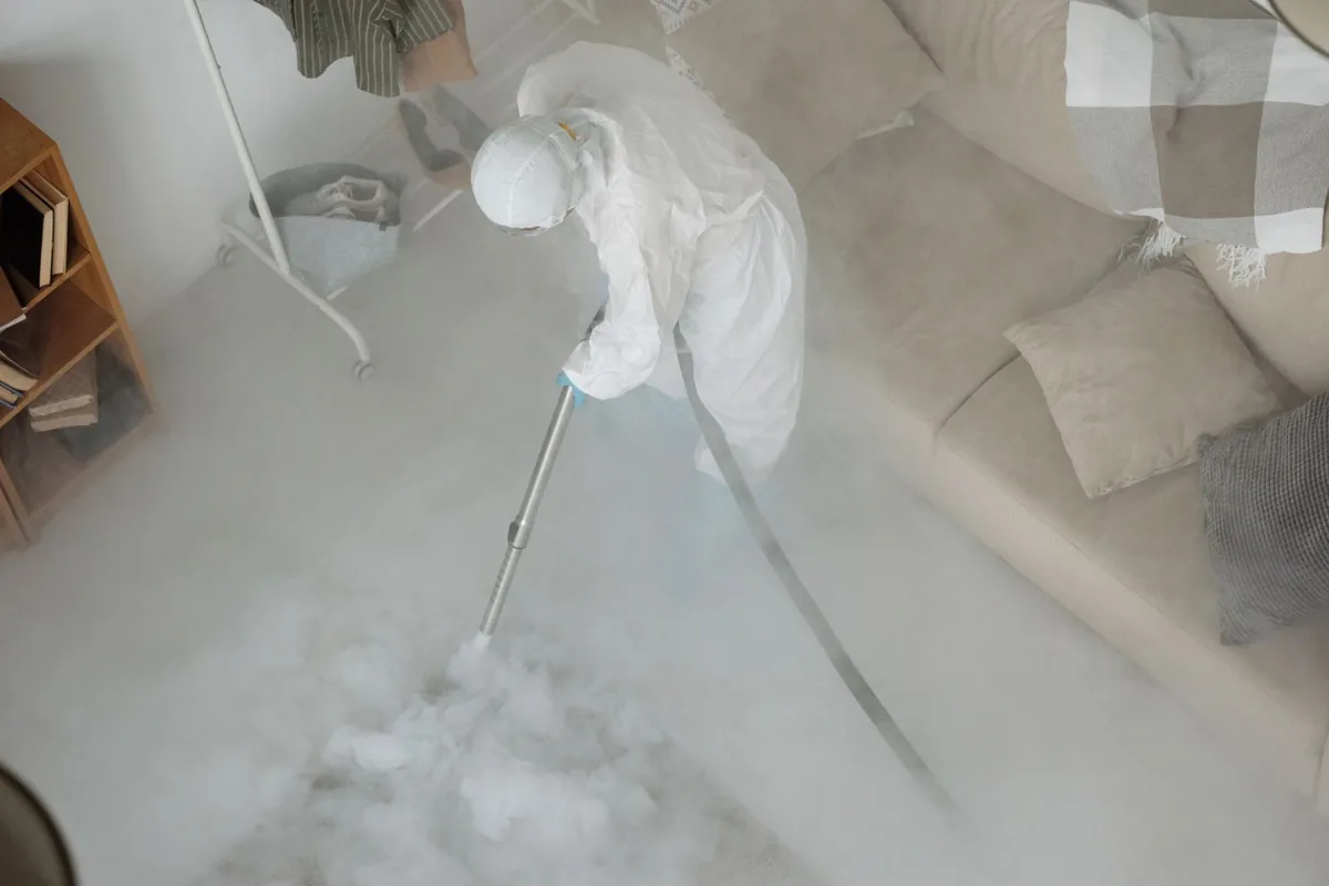 Biohazard cleanup technician in protective equipment, Arlington Heights, Fort Worth, TX